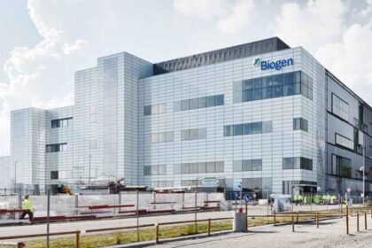 A modern industrial building with the Biogen logo