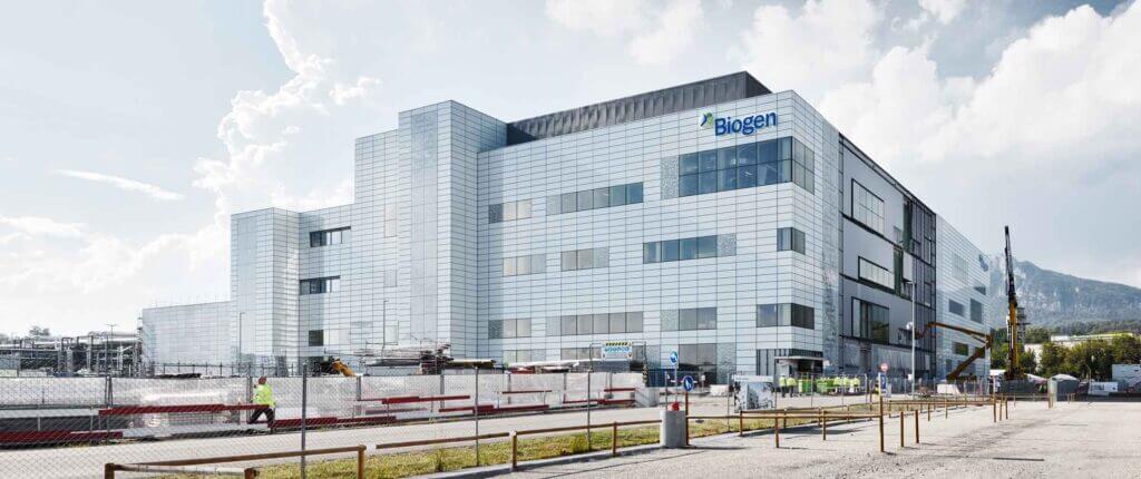 A modern industrial building with the Biogen logo