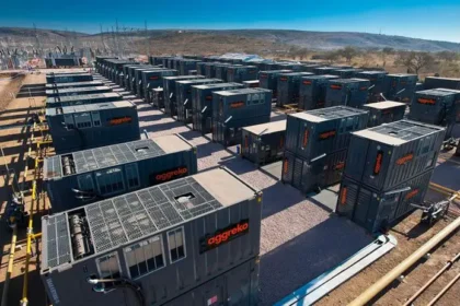 Rows of large Aggreko generators in an outdoor facility.